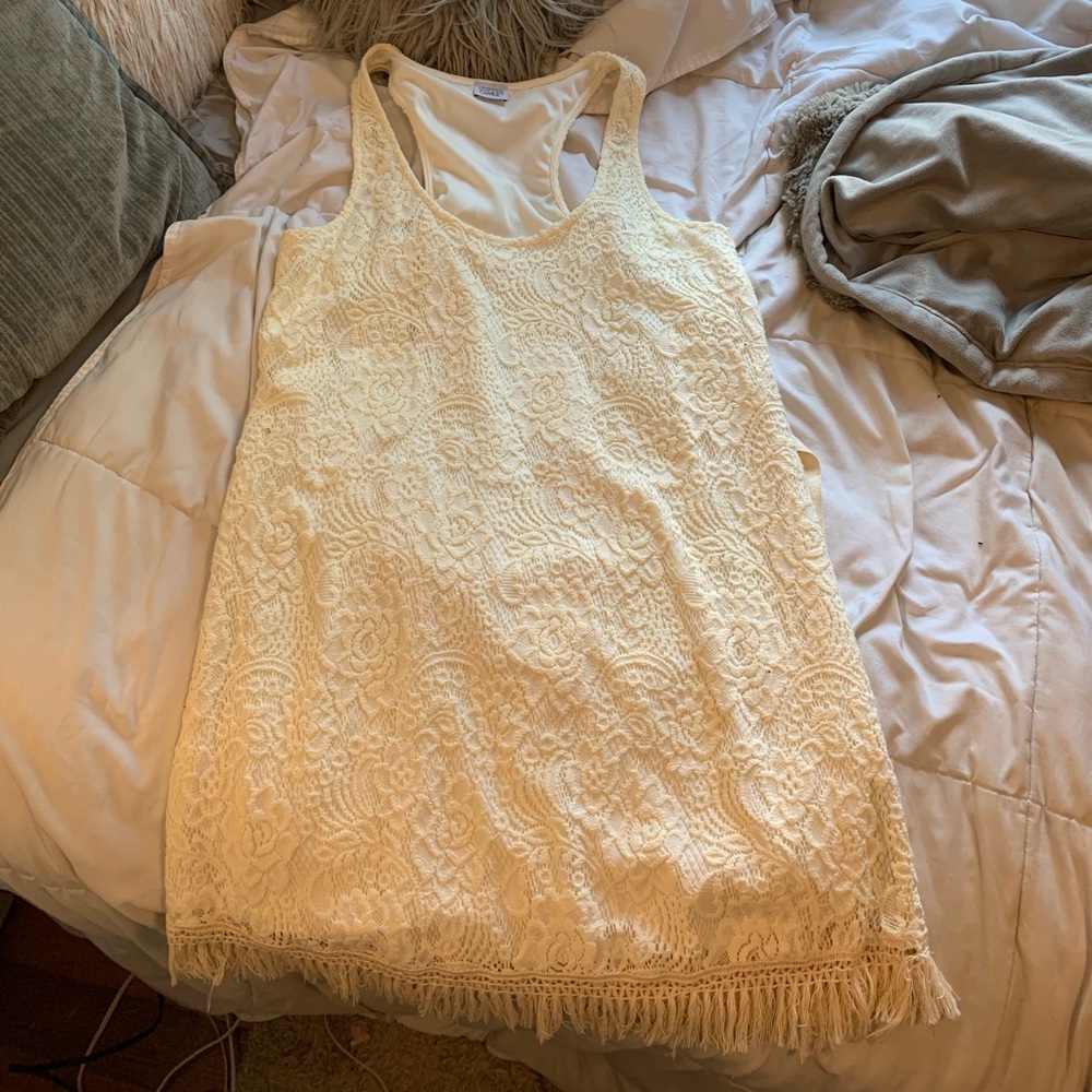 Cream/white colored lace dress with fringe bottom